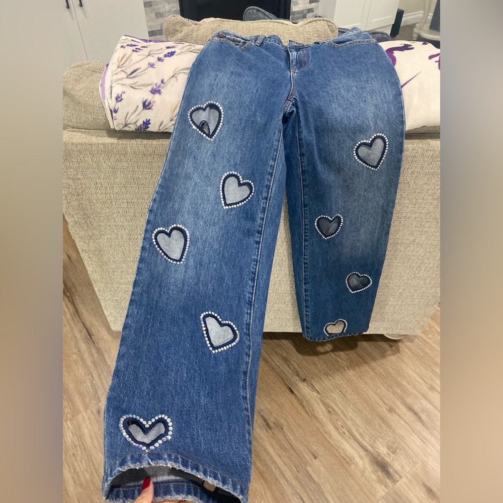 Alic and Olivia brand new bell bottom jeans with rhinestoned shaped hearts !